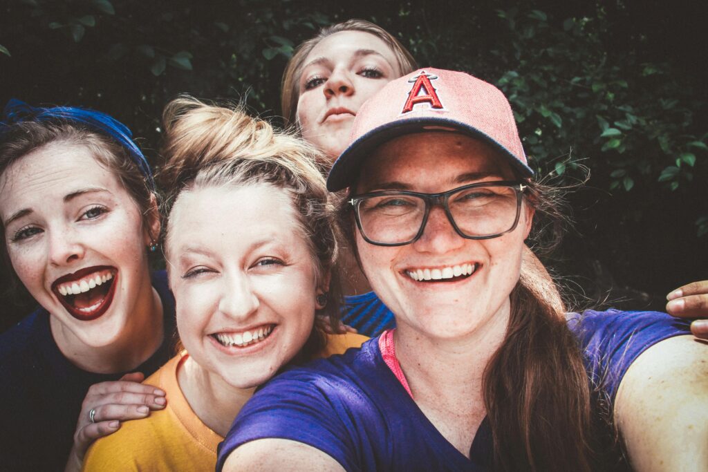 Teenage women taking a selfie.