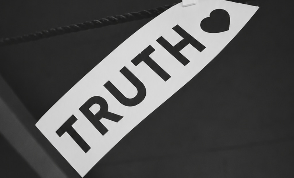 Can You Be Pro-Trans and Christian? Truth label hanging off of string.