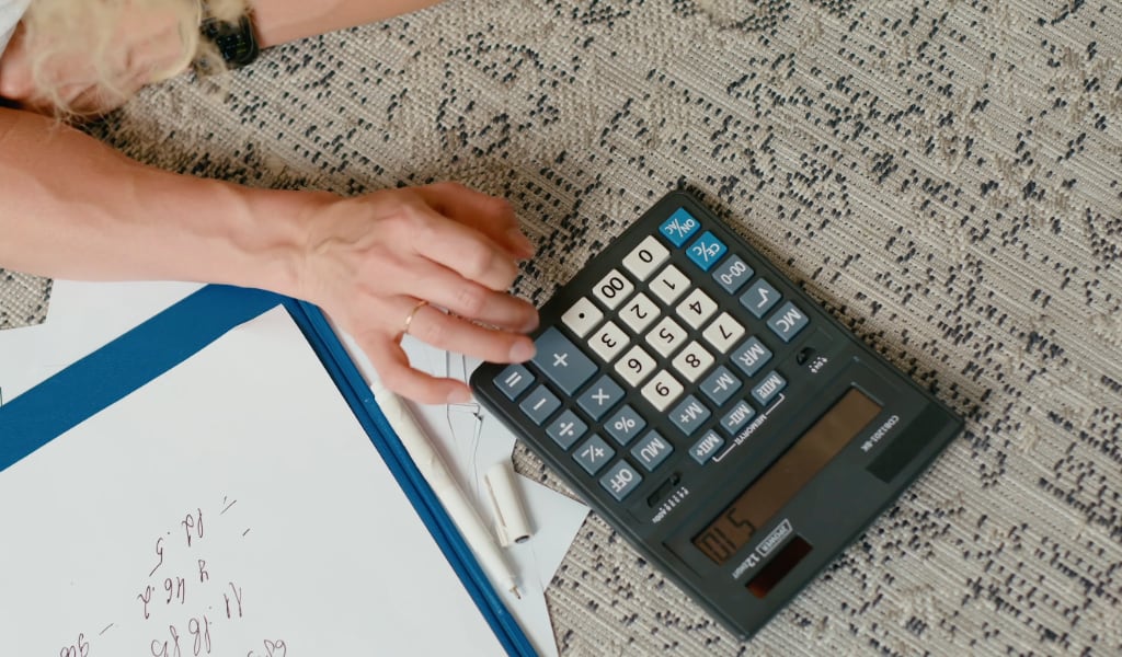 Using a calculator.